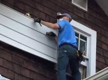 Removing the siding from the Marrons' house.