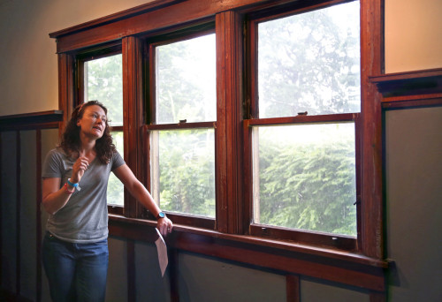 Erica Luna explains window assessment at Chapman House. Photo by Mary Willie. www.photogwillie.com